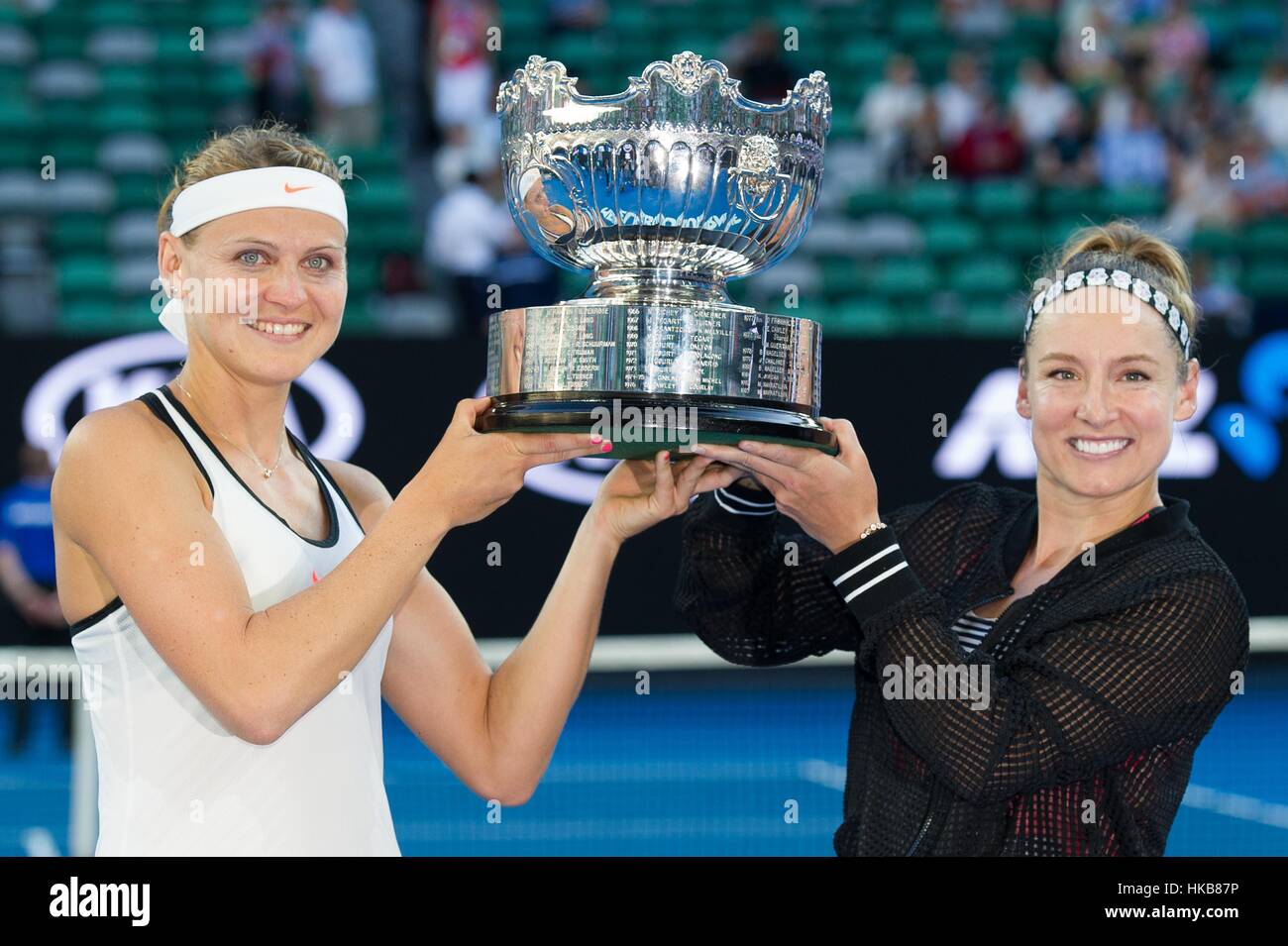 Melbourne, Australia. 27th Jan, 2017. Bethanie Mattek-Sands (R) of the U.S. and Lucie Safarova of the Czech Republic pose for photos after winning the women's doubles final against Andrea Hlavackova of the Czech Republic and Peng Shuai of China at the Australian Open tennis championships in Melbourne, Australia, Jan. 27, 2017. Bethanie Mattek-Sands of the U.S. and Lucie Safarova of the Czech Republic won 2-1. Credit: Bai Xue/Xinhua/Alamy Live News Stock Photo