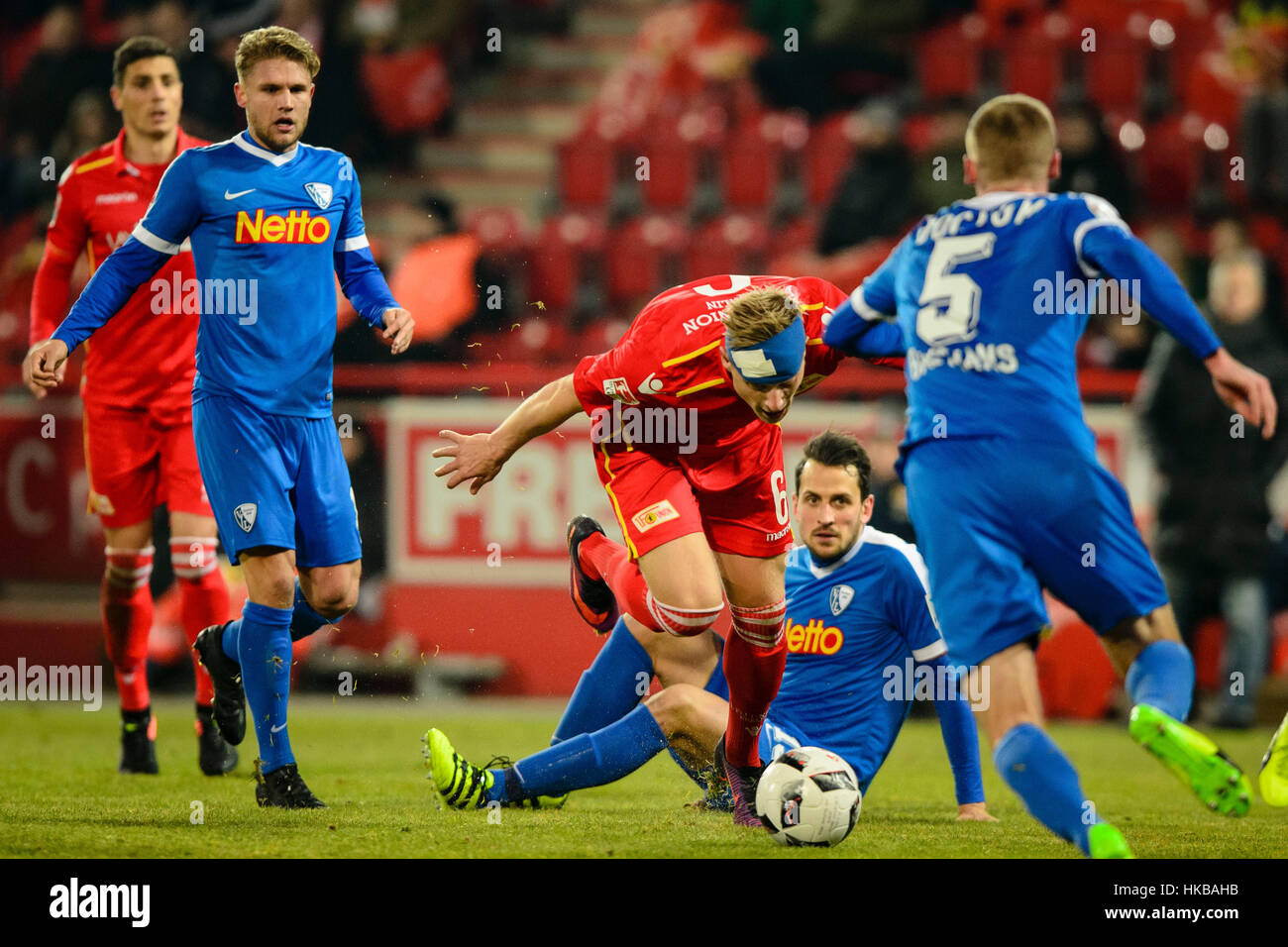 Berlin, Germany. 27th Jan, 2017. Berlin's Kristian Pedersen and Bochum's Marco Stiepermann (l-r), Patrick Fabian and Felix Bastians in action during the 2nd Bundesliga soccer match between 1. FC Union Berlin and VfL Bochum at the Alte Foersterei stadium in Berlin, Germany, 27 January 2017. (EMBARGO CONDITIONS - ATTENTION: Due to the accreditation guidlines, the DFL only permits the publication and utilisation of up to 15 pictures per match on the internet and in online media during the match.) Photo: Britta Pedersen/dpa-Zentralbild/dpa/Alamy Live News Stock Photo
