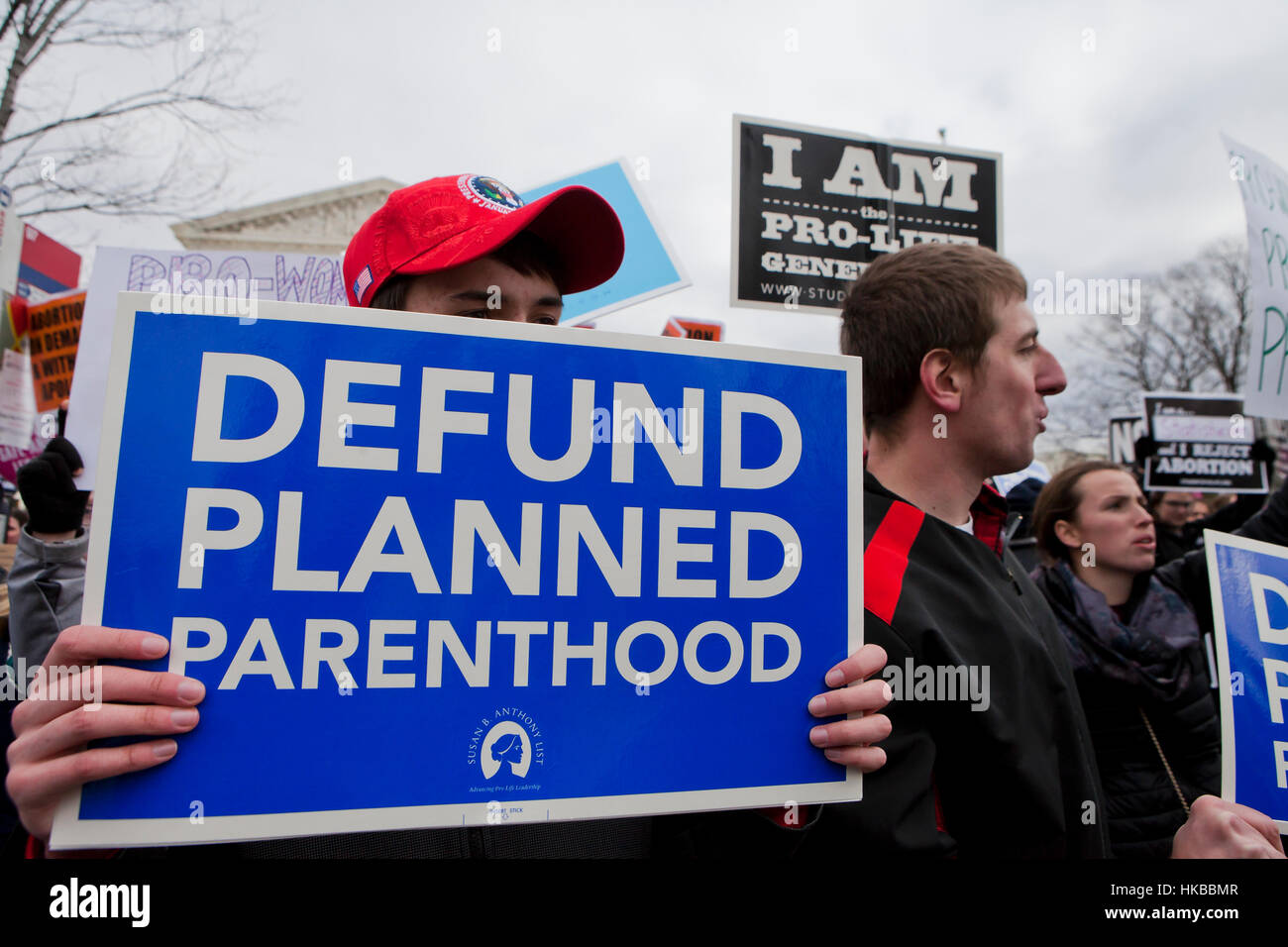 Washington, DC, USA. 27th January, 2017.Thousands of pro-life activists march from the National Mall to the Supreme Court building for the annual Pro-Life March.  Many pro-choice activists also gather in front of the Supreme Court, where both sides protest side by side. Credit: B Christopher/Alamy Live News Stock Photo