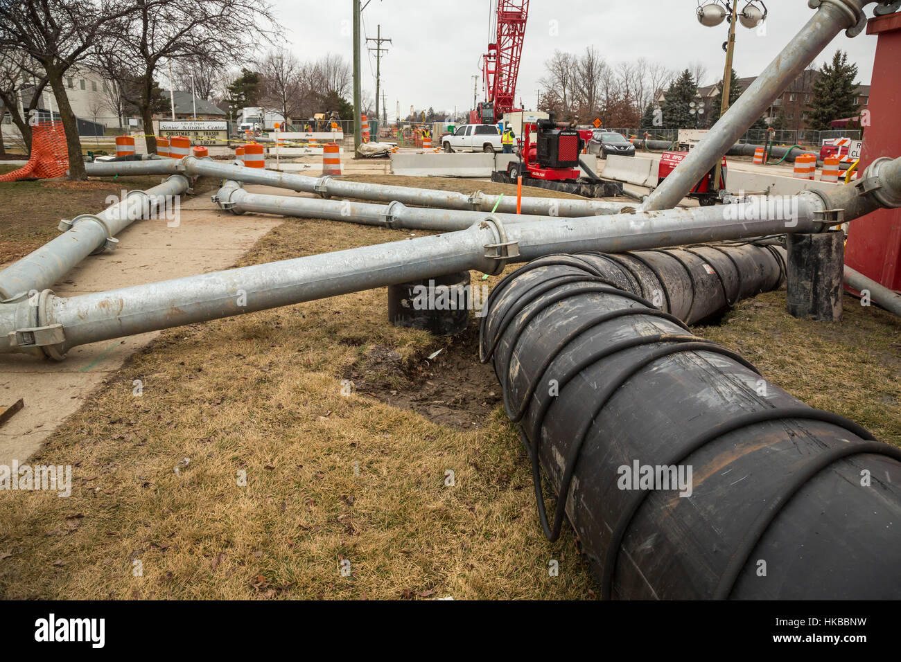 Fraser, USA. 27th January, 2017. The collapse of an 11-foot-wide underground sewer line threatens environmental problems for 11 communities in suburban Detroit. The collapse created a sinkhole that destroyed three houses. Officials estimate that repairing the sewer line could cost $100 million. Until the line is fixed, they say it may be necessary to divert raw sewage into the Clinton River. Credit: Jim West/Alamy Live News Stock Photo