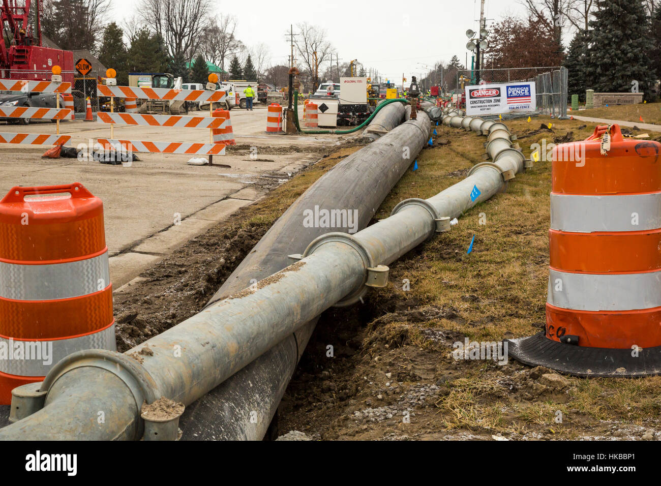 Fraser, USA. 27th January, 2017. The collapse of an 11-foot-wide underground sewer line threatens environmental problems for 11 communities in suburban Detroit. The collapse created a sinkhole that destroyed three houses. Officials estimate that repairing the sewer line could cost $100 million. Until the line is fixed, they say it may be necessary to divert raw sewage into the Clinton River. Credit: Jim West/Alamy Live News Stock Photo