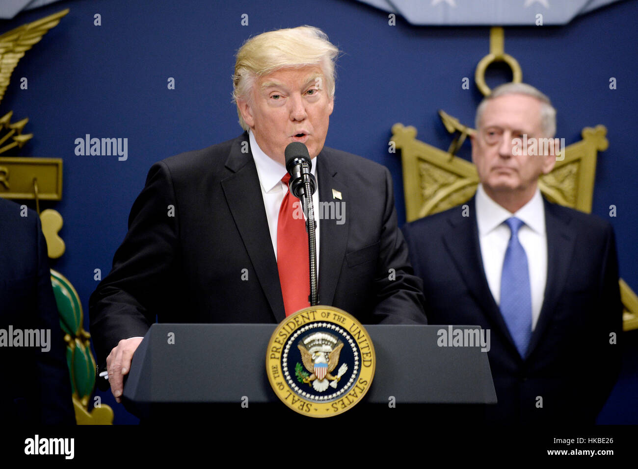 Washington, Us. 27th Jan, 2017. United States President Donald Trump speaks as Secretary of Defense James Mattis looks on in the Hall of Heroes at the Department of Defense in Virginia, January 27, 2017. Credit: Olivier Douliery/Pool via CNP - NO WIRE SERViCE - Photo: Olivier Douliery/Consolidated/dpa/Alamy Live News Stock Photo