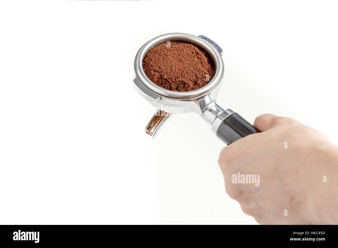 Barista hold the portafilter with coffee ground, prepare to tamp and