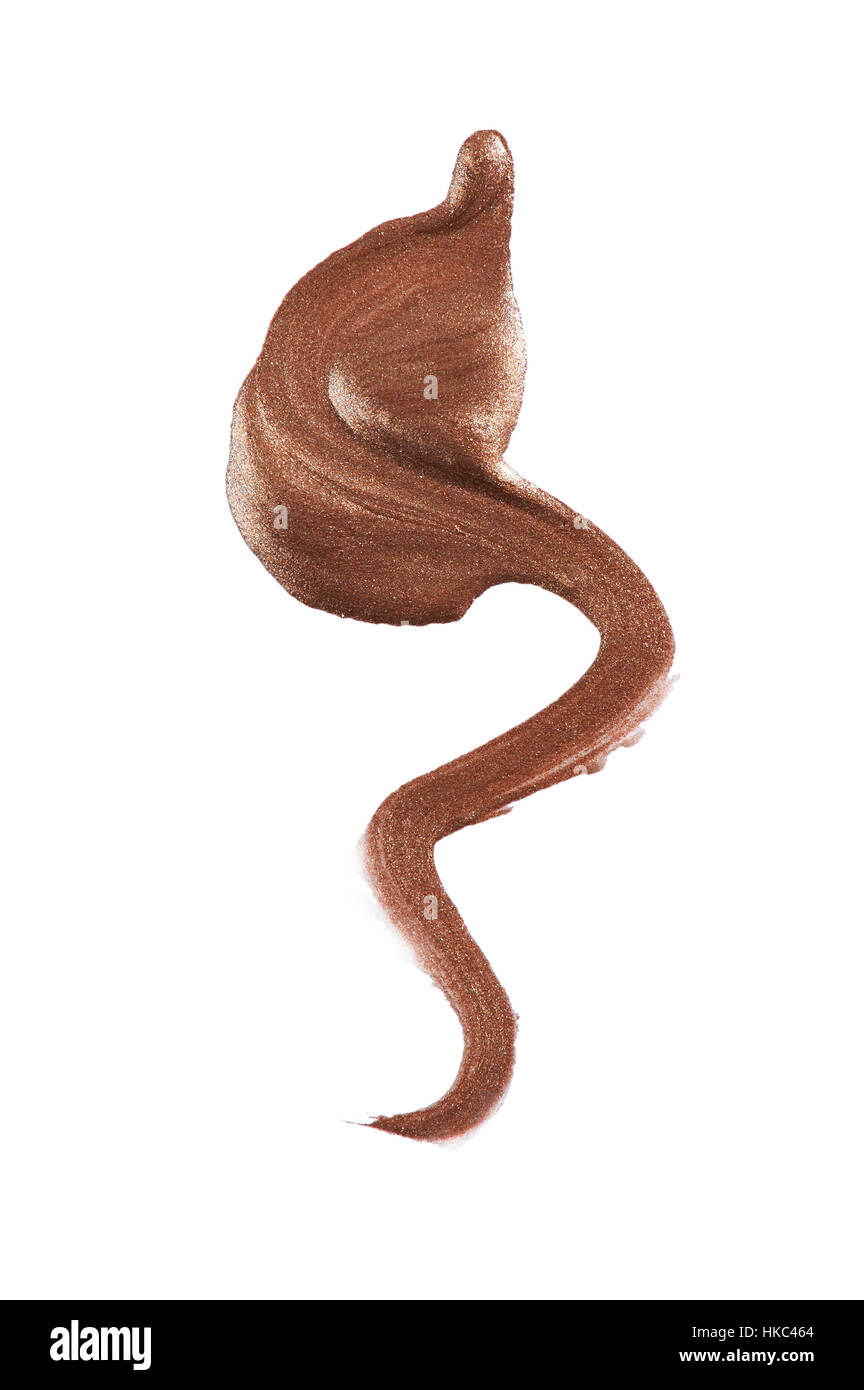A beauty cut out image of a sample of metallic bronze liquid eye liner. Stock Photo