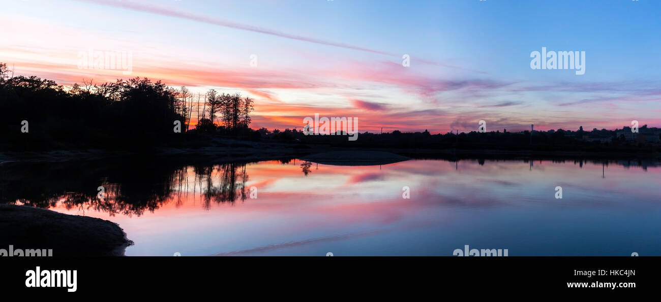 sunset over the lake, the red sunlight, panorama, romantic in nature ...