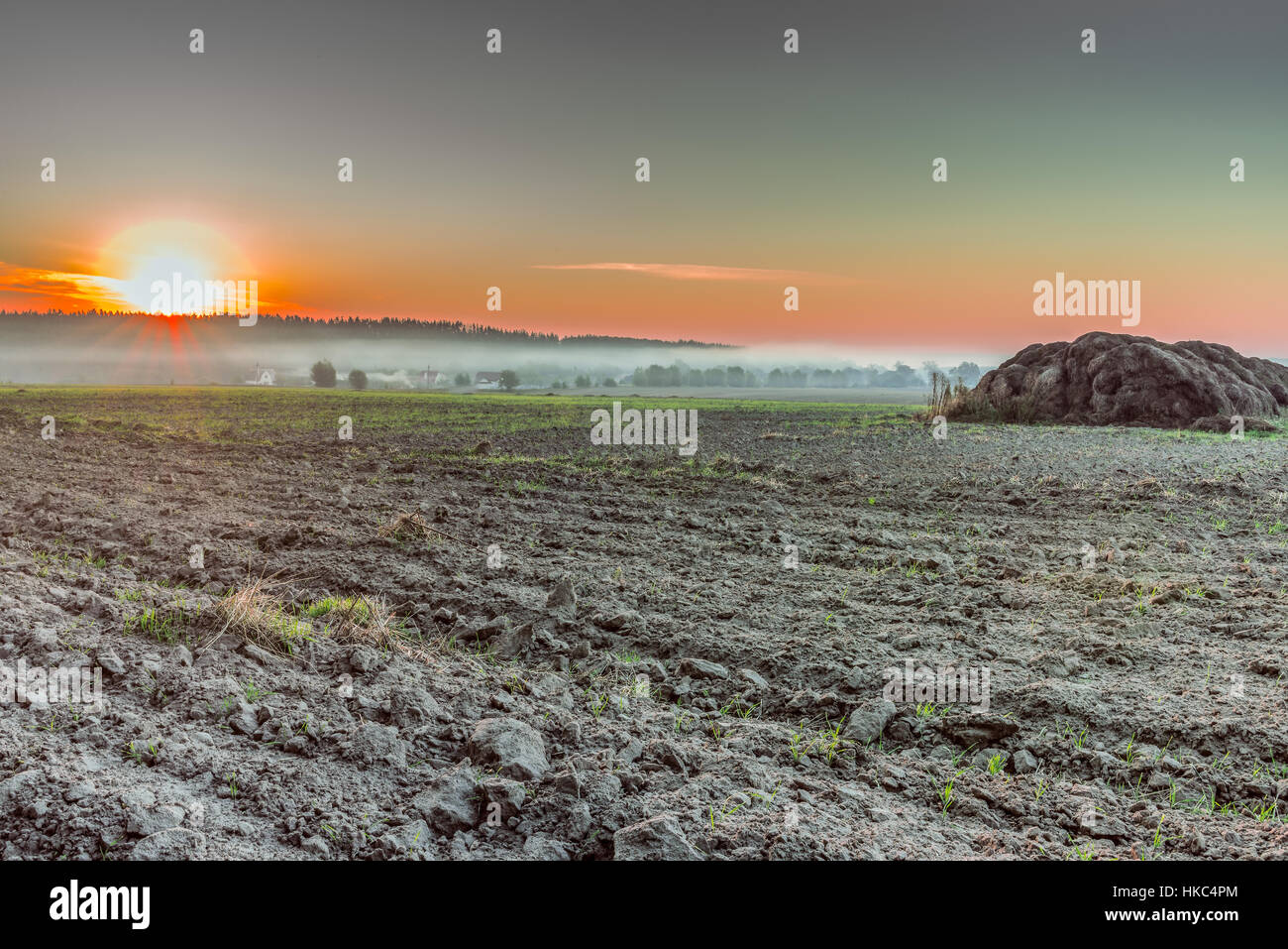 Dawn in a plowed field. This photo was taken in a field not far from Kiev. Stock Photo
