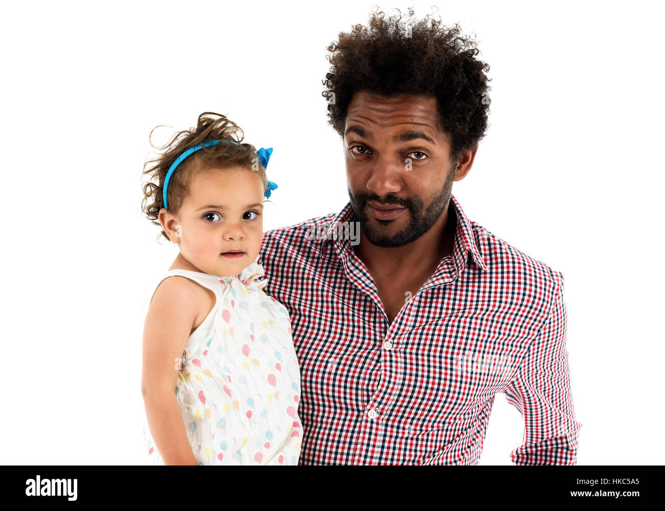 African American father and mulatto daughter together isolated on white background. Happy single parent. Man is wearing afro hair style and a color sh Stock Photo