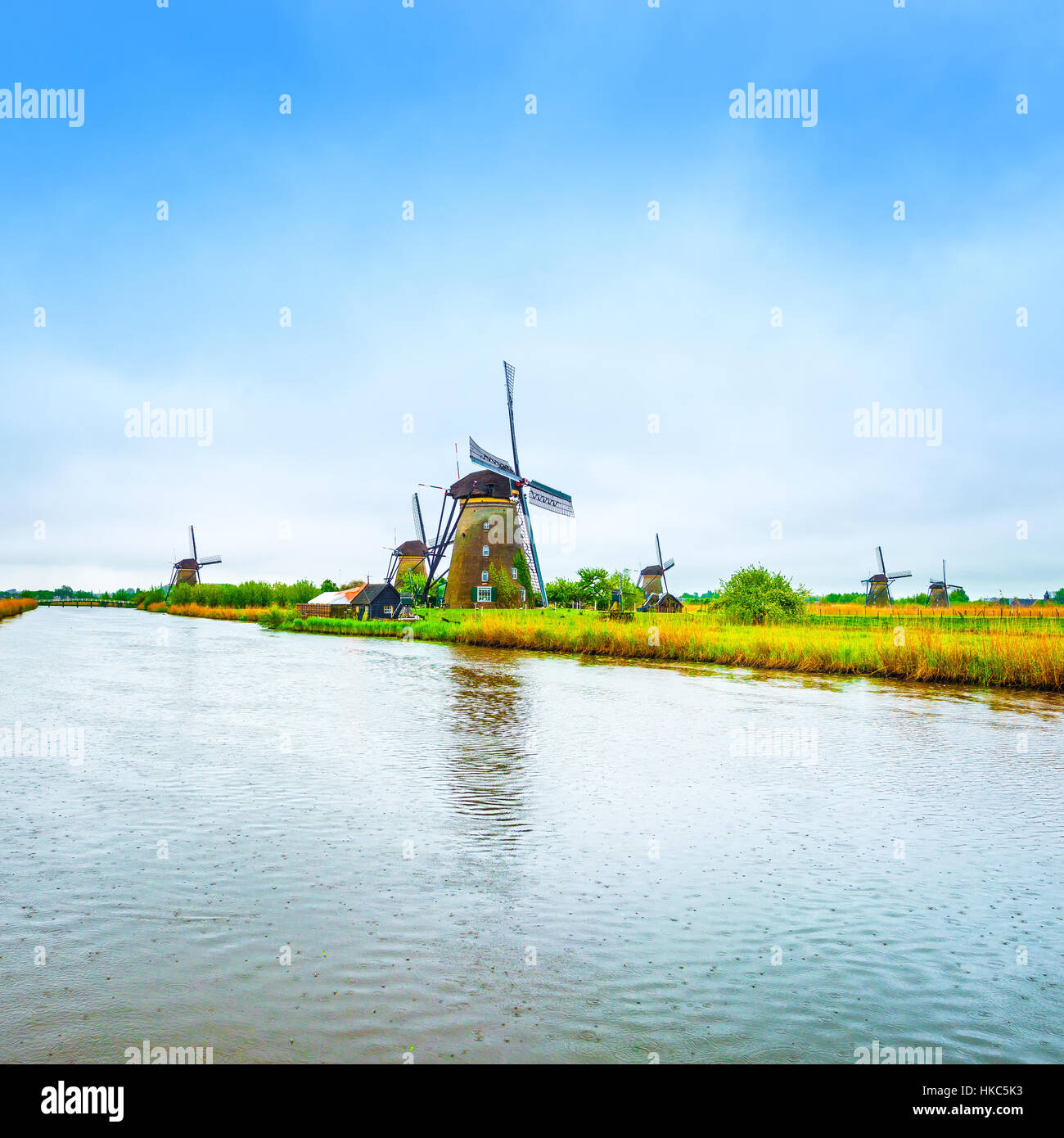 Windmills and water canal in Kinderdijk, Holland or Netherlands. Unesco world heritage site. Europe. Stock Photo