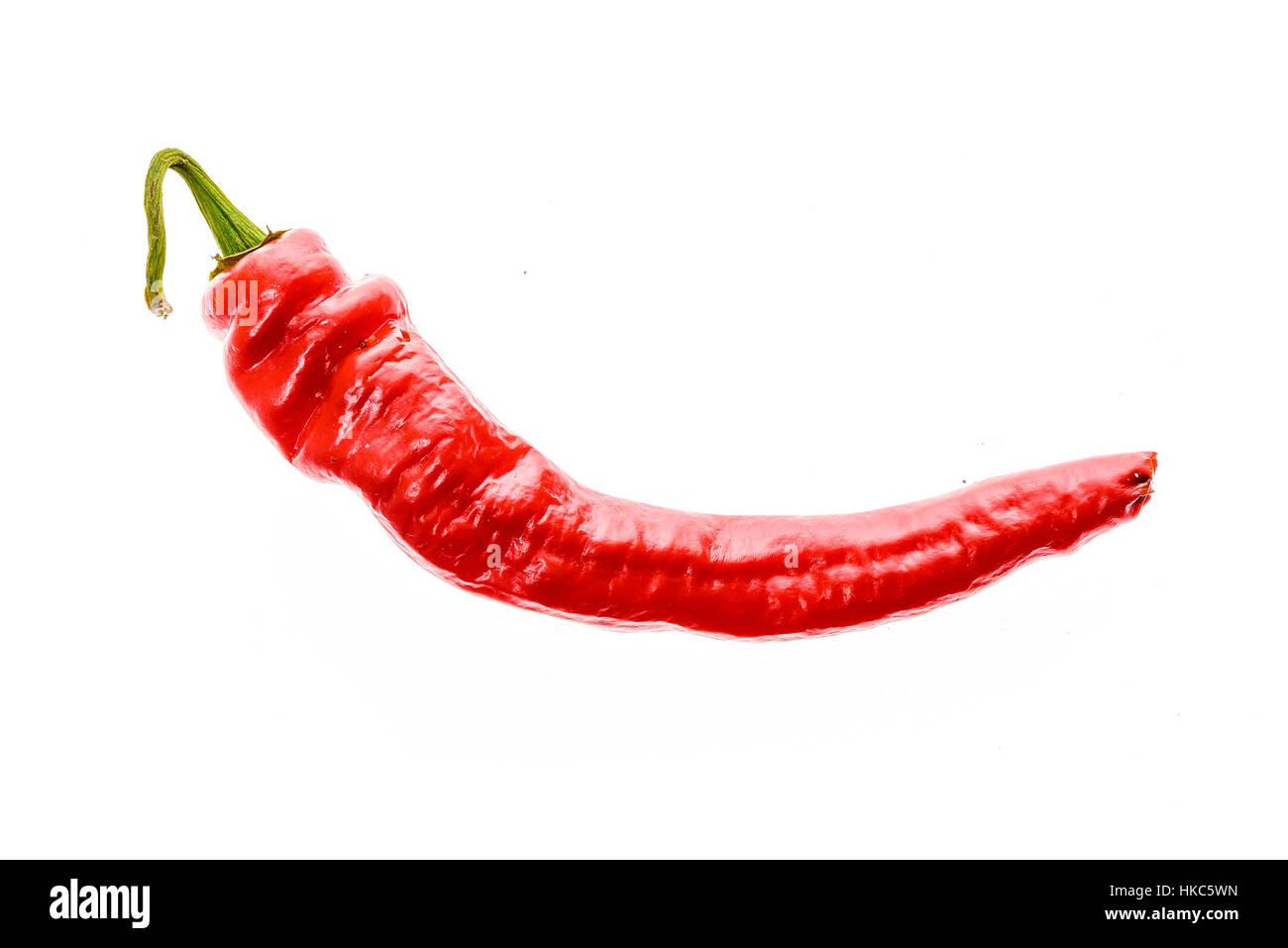 Red hot chili peppers Cayenne, Serrano with green stem. Cayenne, Serrano or Sicilian variety of chili. Studio image Isolated  on white background. Stock Photo