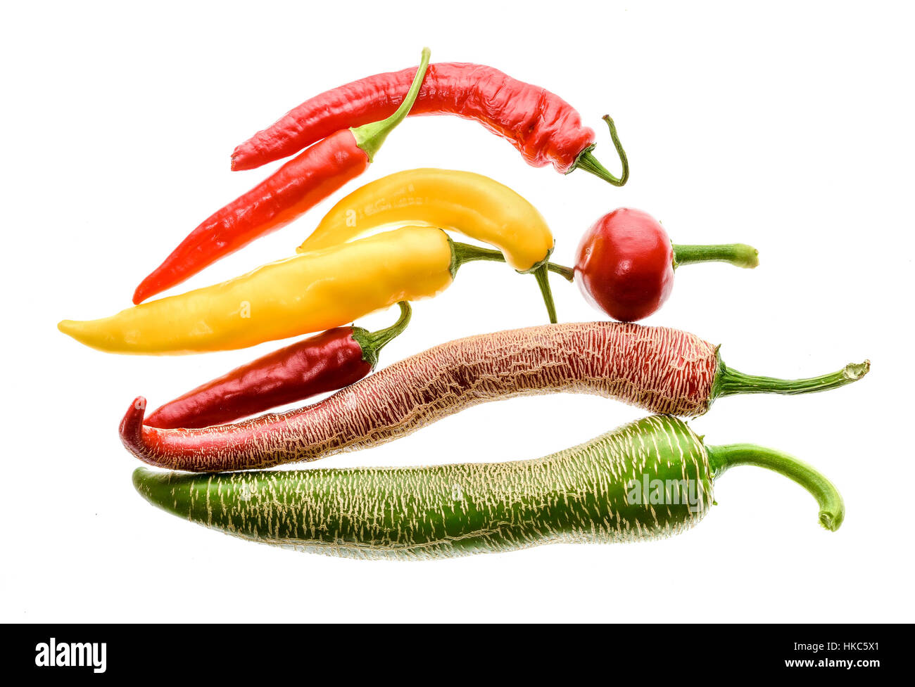 Different variety of hot peppers or chilies, isolated on white. Hot
