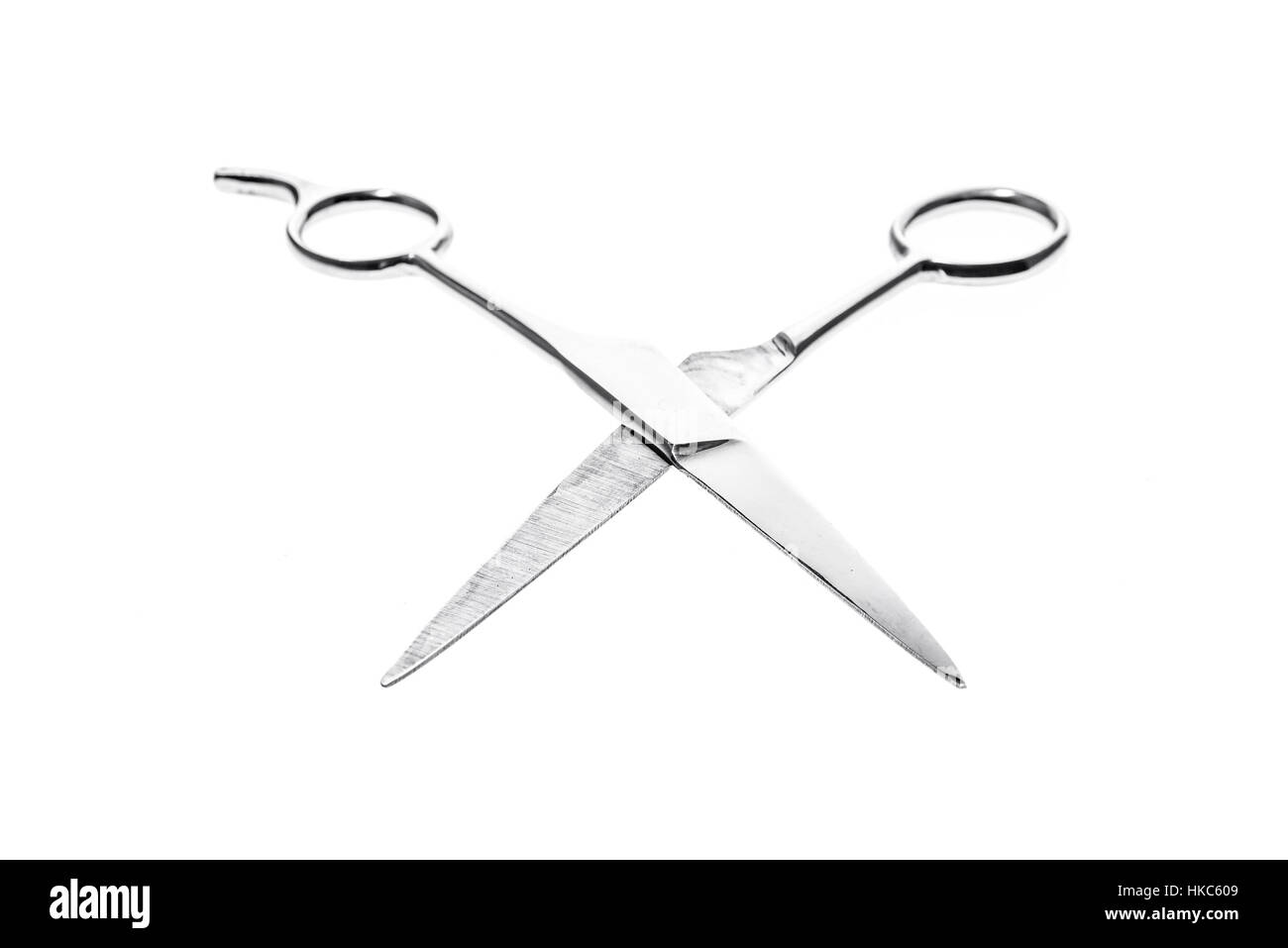 Hairdresser or barber silver professional scissors for cutting hair. Isolated on white background Stock Photo