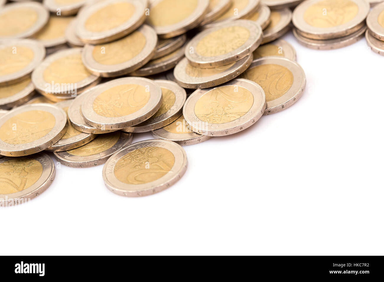Heap of two euro coins isolated on white background Stock Photo - Alamy