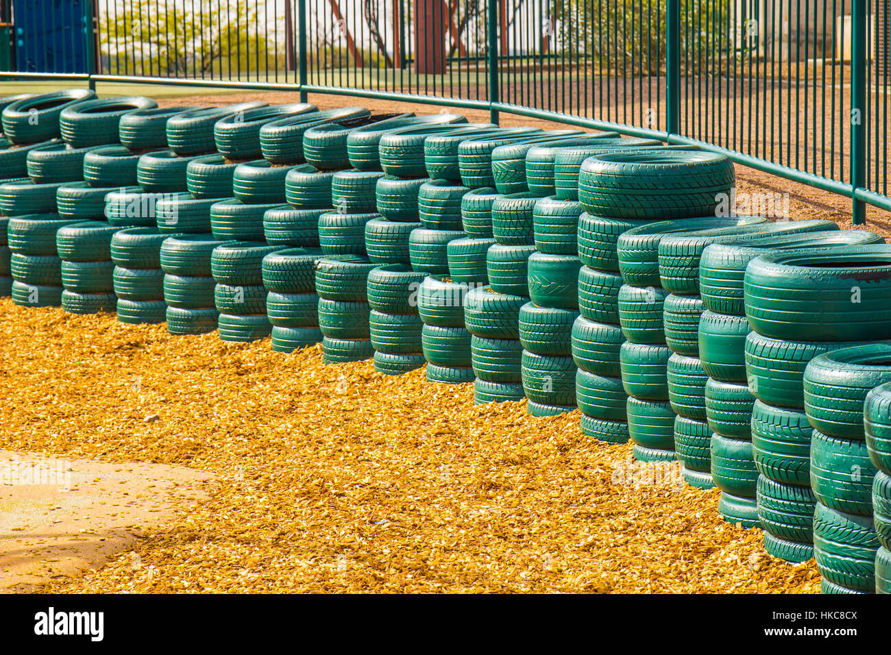 Green Rubber Tires Used As Bumpers For Small Children At Playground Stock Photo