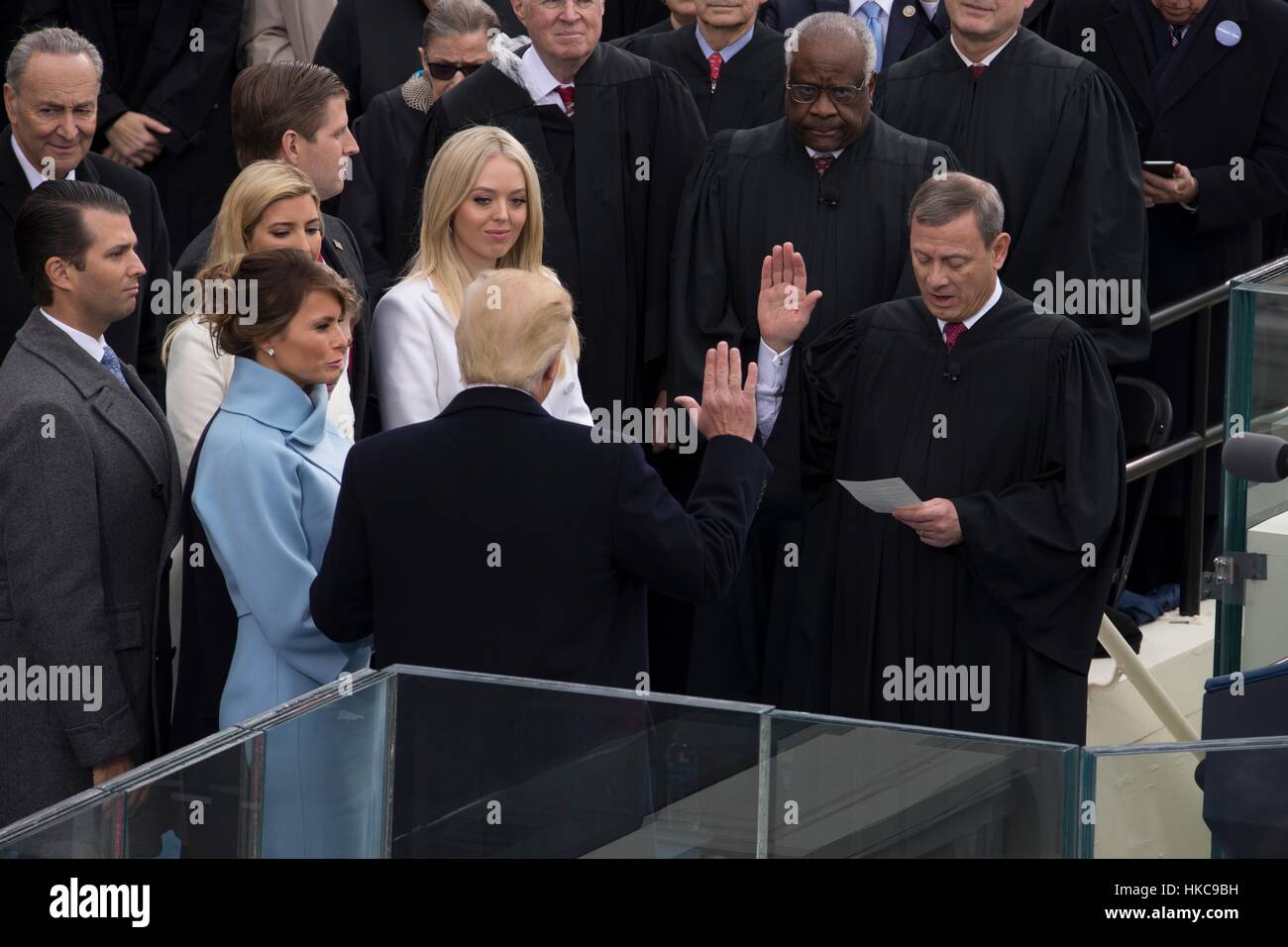 U.S. Supreme Court Chief Justice John Roberts administers the oath of office to President-elect Donald Trump during the 58th Presidential Inauguration at the U.S. Capitol Building January 20, 2017 in Washington, DC. Stock Photo