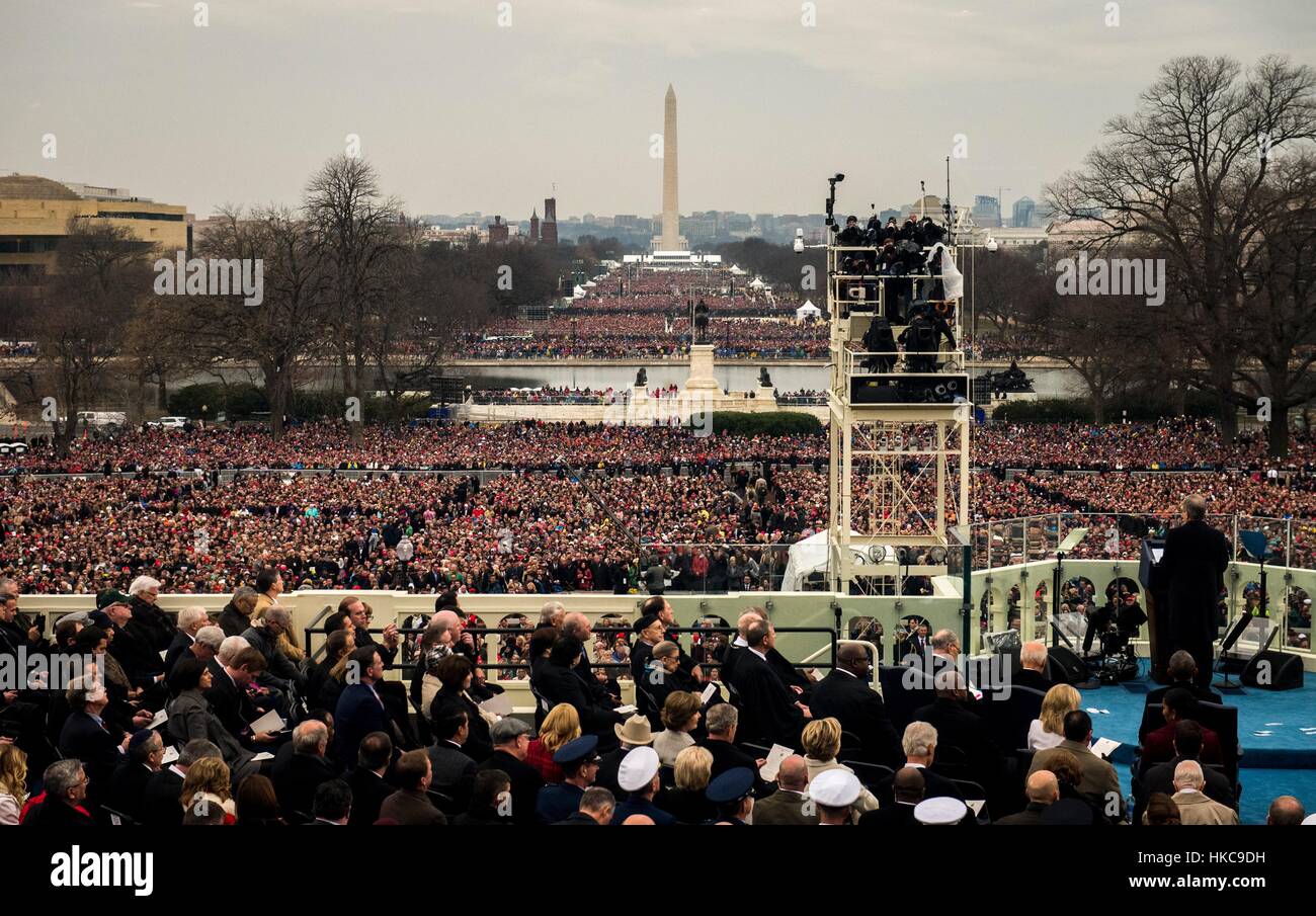 A crowd gathers in front of the Washington Monument during the 58th Presidential Inauguration of Donald Trump January 20, 2017 in Washington, DC. Stock Photo