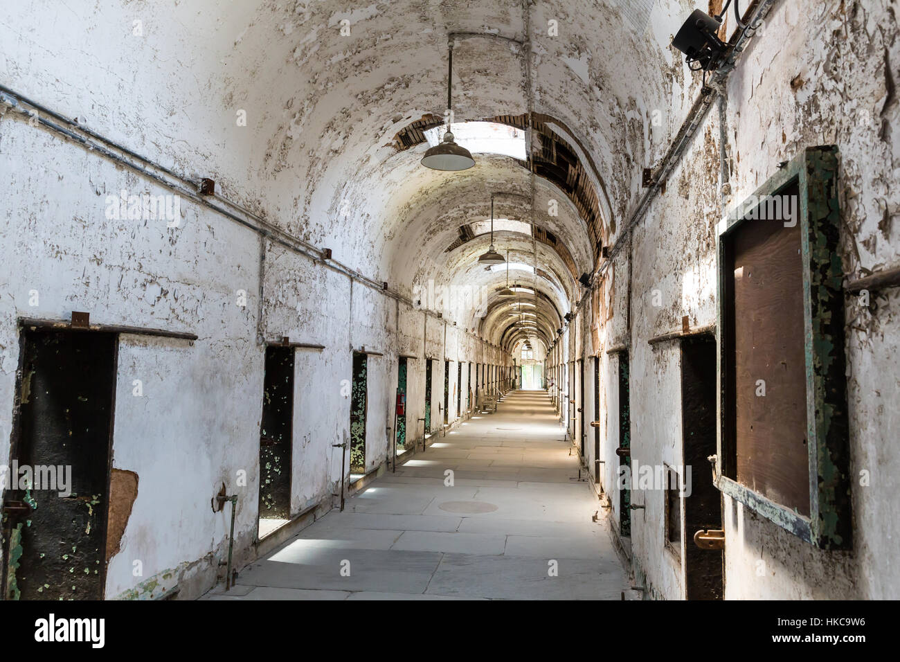 Jail hallway with locked doors. Stock Photo
