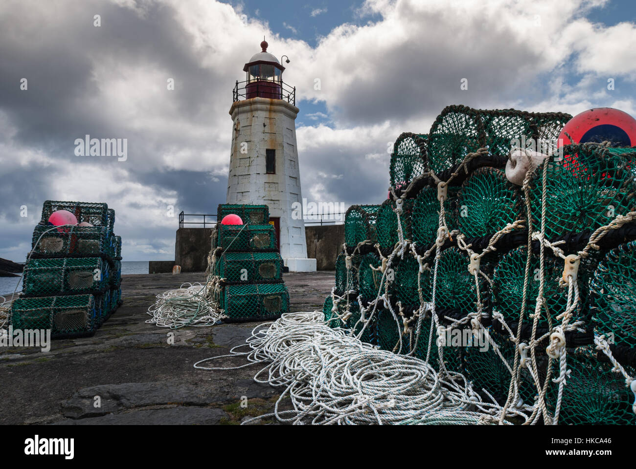 Lobster traps and lighthouse in Lybster, Scotland Stock Photo Alamy