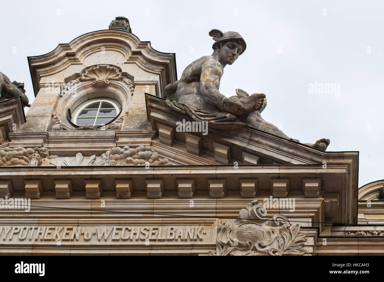 Mercury. Statue by German sculptor Hugo Kaufmann on the roof of the Neo-Baroque bank building in Munich, Bavaria, Germany. The building designed by German architect Emil Schmidt was built in 1895-1896 for the Bayerische Hypotheken- und Wechsel-Bank in Kardinal-Faulhaber-Straße 10. Stock Photo