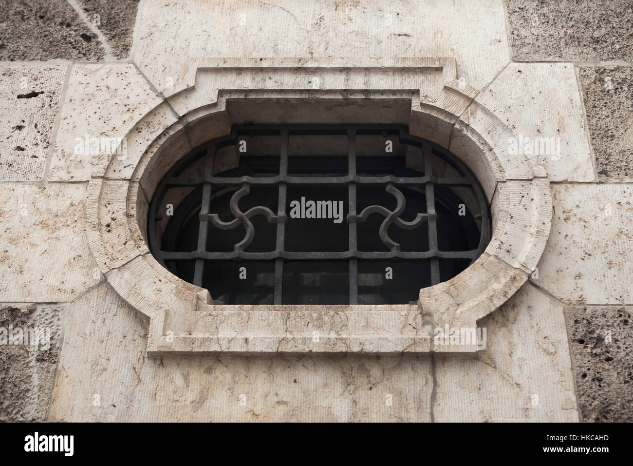 Nazi swastika in the window grille on the building of the Bavarian Ministry of Economic Affairs, Infrastructure, Transport and Technology in Munich, Bavaria, Germany. The building was built in 1937-1938 for the South Air Force Command (Luftgaukommando Sud). This swastika is one of the few still remain in situ from Nazi era. Stock Photo