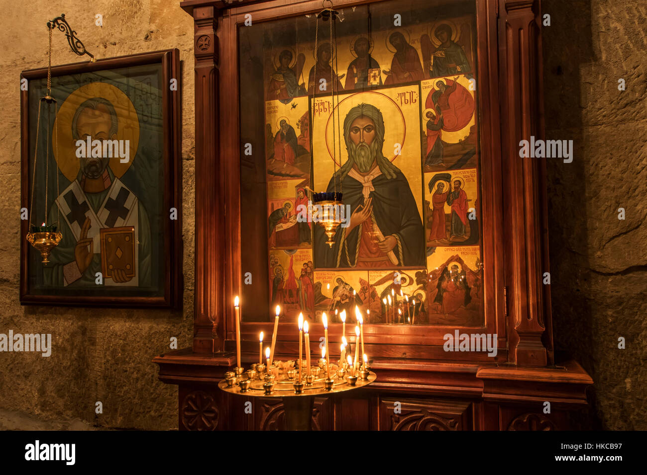 Lit candles by a Christian Orthodox icon in the interior of Svetitskhoveli Cathedral; Mtskheta