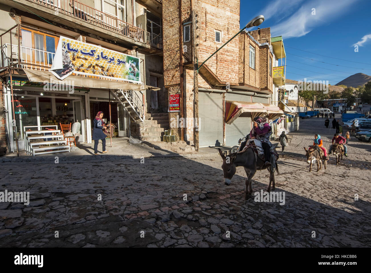 People riding on donkeys; Kandovan, East Azarbaijan, Iran Stock Photo