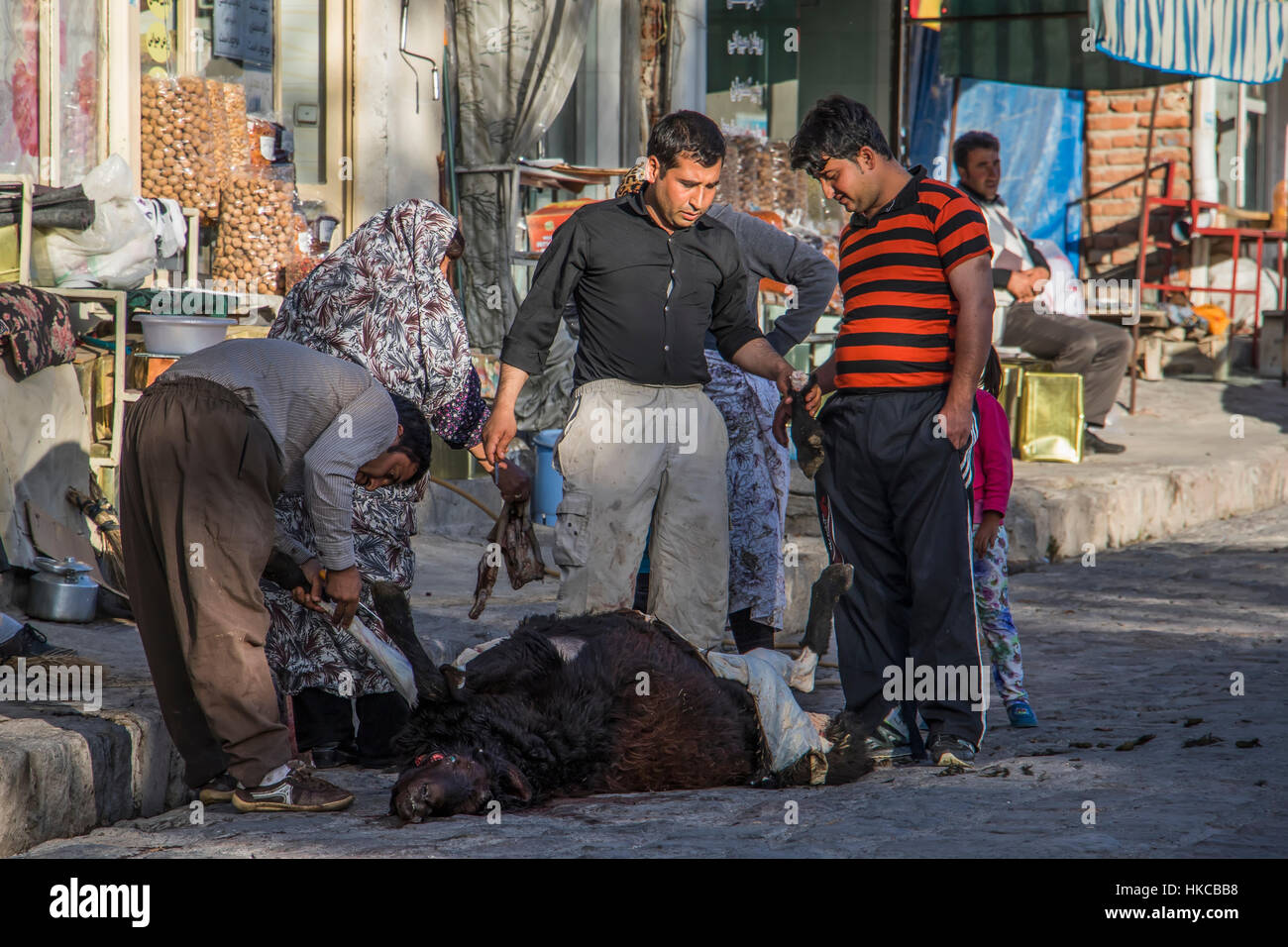 People skinning a sheep; Kandovan, East Azarbaijan, Iran Stock Photo