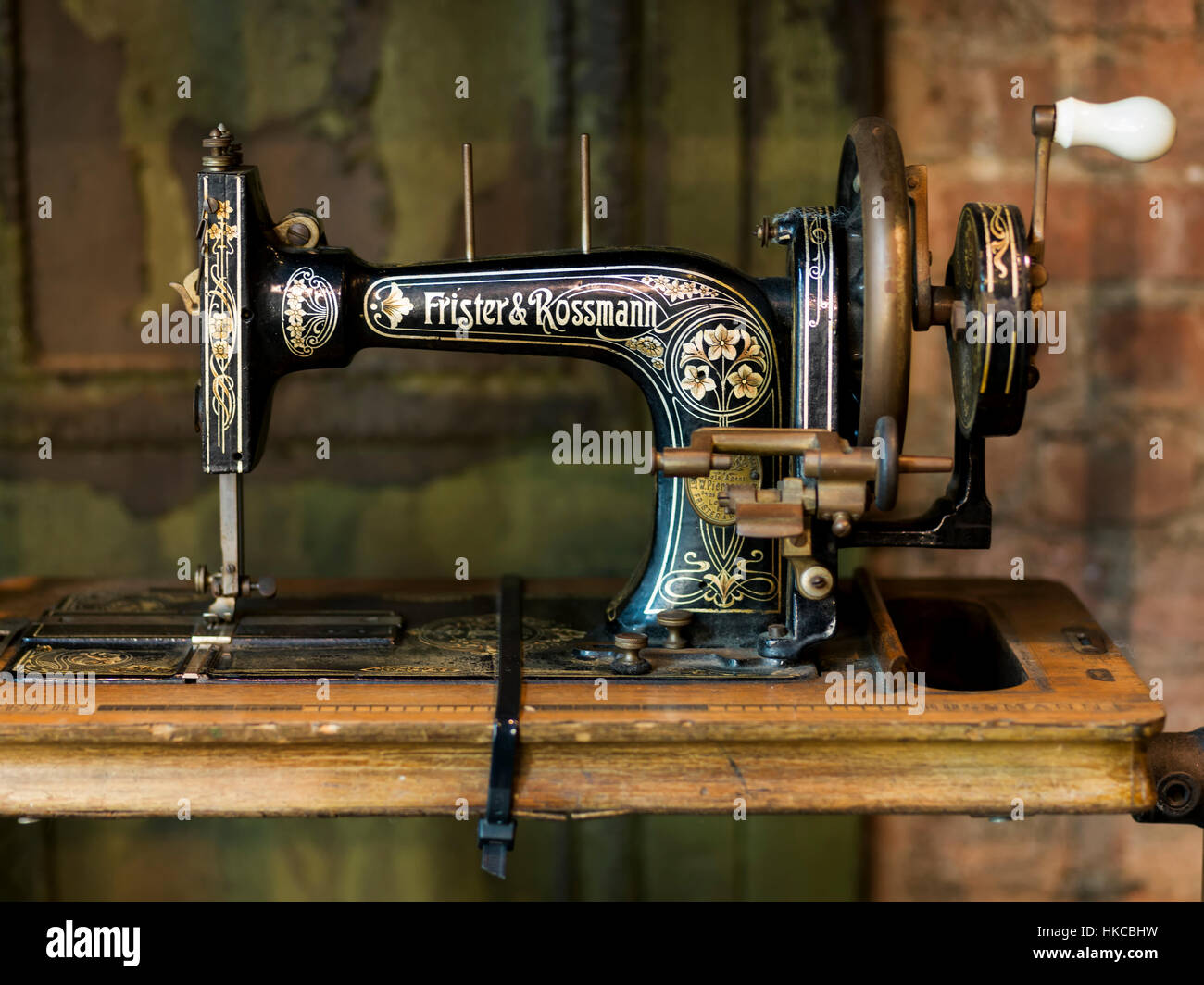 Old sewing machine on a wooden table, Lower Manhattan, Soho; New York City, New York, United