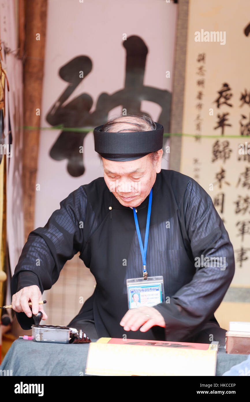 A scholar writes Chinese calligraphy characters at Temple of Literature on January 26,2017 Stock Photo