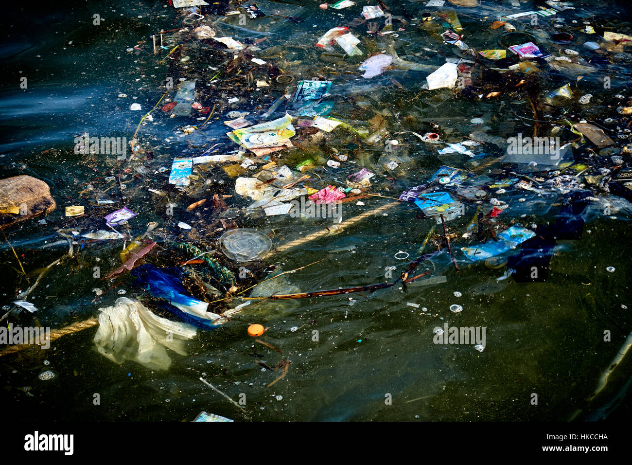 HONG KONG - MAY 25: Marine pollution around Hung Shing Ye beach on Lamma Island just off Hong Kong on May 25, 2014. In the summer and with prevailing  Stock Photo