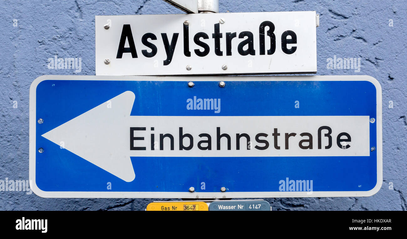 Street signs Asylum Street and one-way street, Weiden, Bavaria, Germany Stock Photo