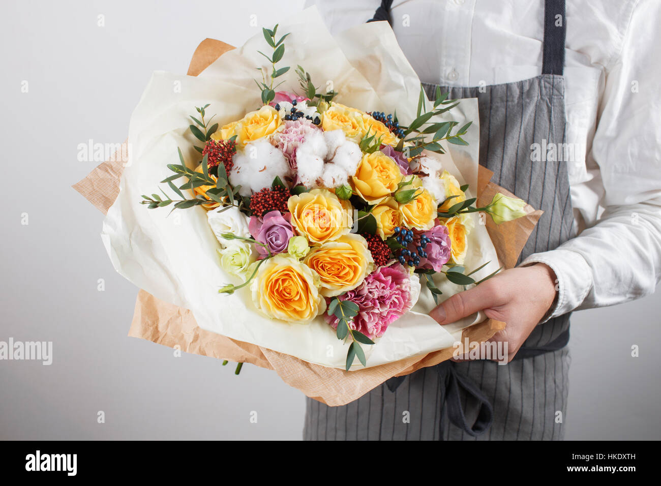 beautiful bouquet made of different flowers in young man hand ...