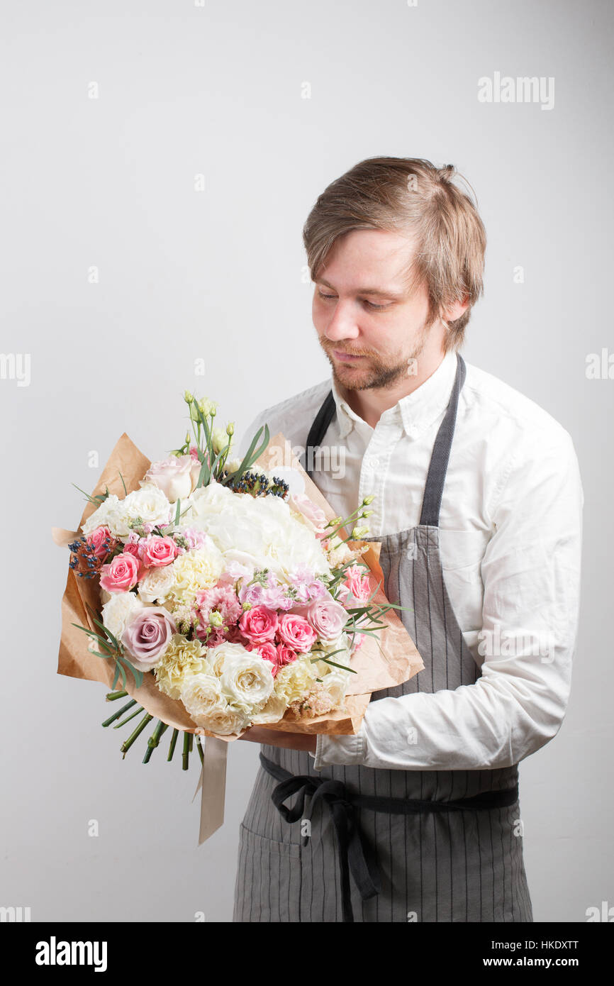 beautiful bouquet made of different flowers in young man hand ...