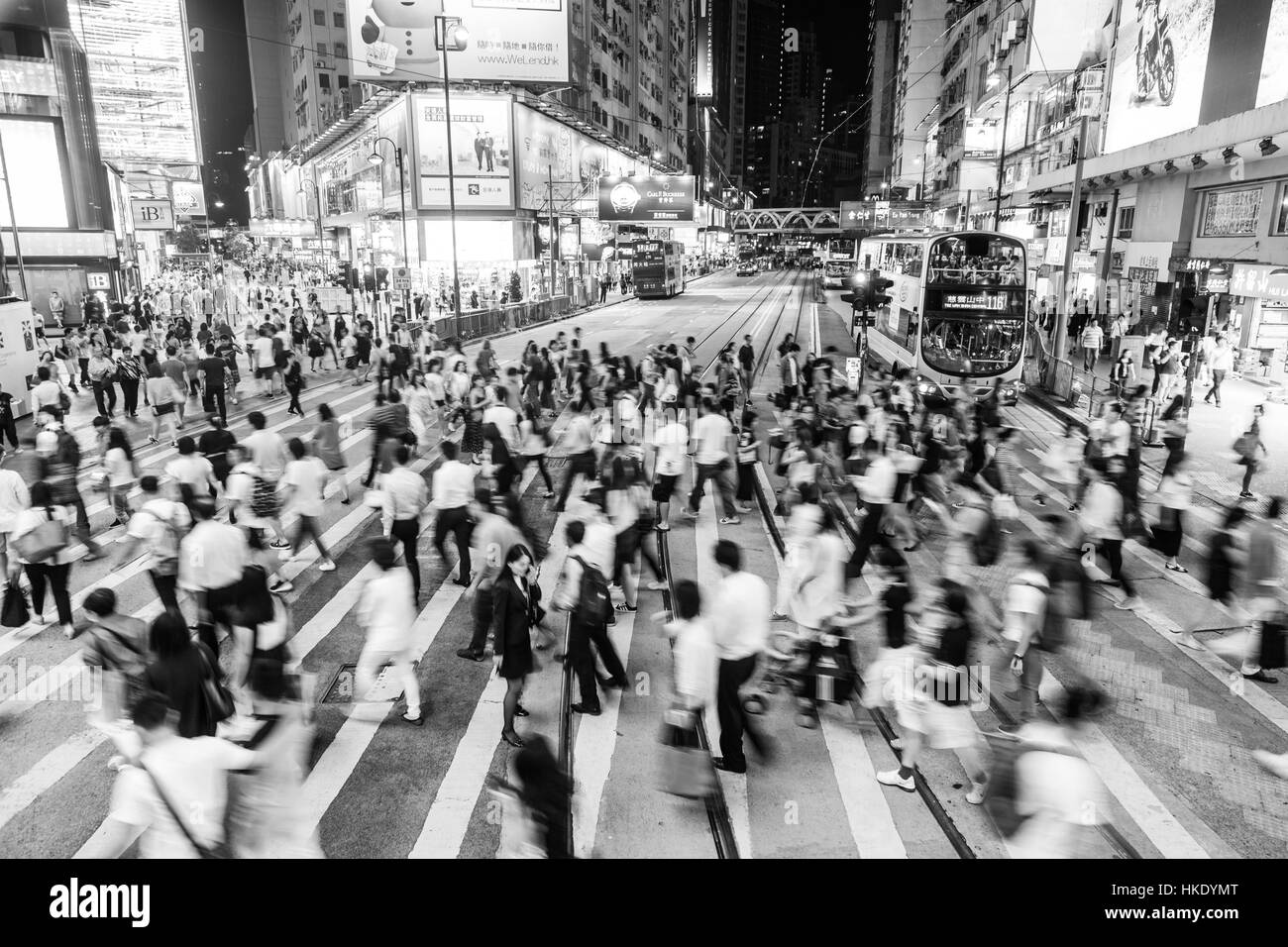 HONG KONG, HONG KONG - SEPTEMBER 23 2015: Pedestrians rush through a very busy intersection in the shopping district of Causeway Bay in Hong Kong isla Stock Photo