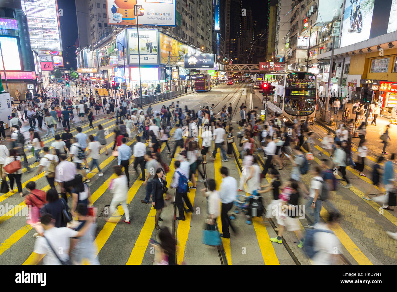 HONG KONG, HONG KONG - SEPTEMBER 23 2015: Pedestrians rush through a very busy intersection in the shopping district of Causeway Bay in Hong Kong isla Stock Photo