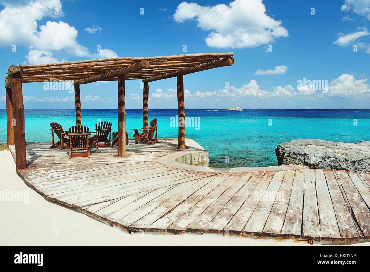 Wood terrace next to beach with blue water Stock Photo Alamy