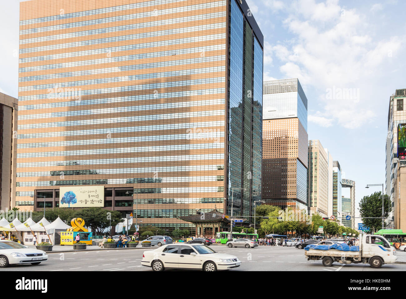 SEOUL, SOUTH KOREA - SEPTEMBER 12, 2015: Cars and buses drive along Seoul main avenue in the business district of South Korea capital city. Stock Photo