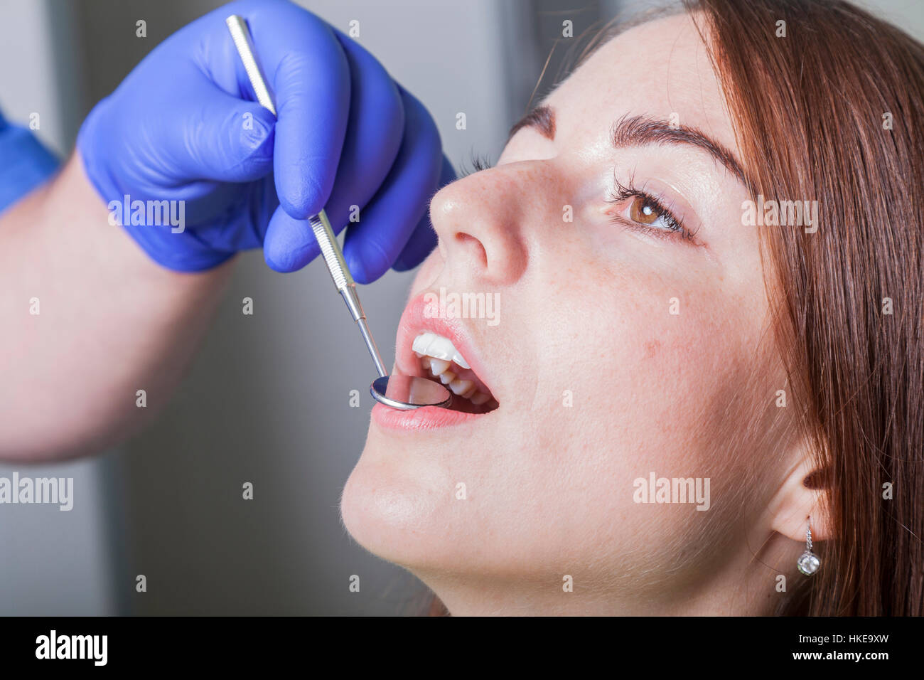 Patient with open mouth and mirror inside at the dentist Stock Photo ...