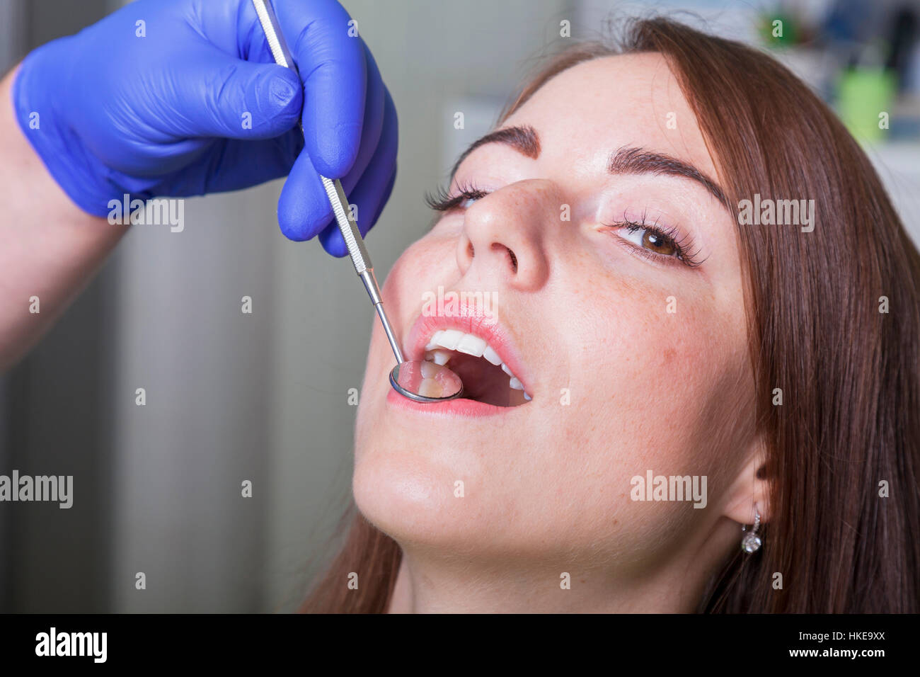 Patient with open mouth and mirror inside at the dentist Stock Photo ...