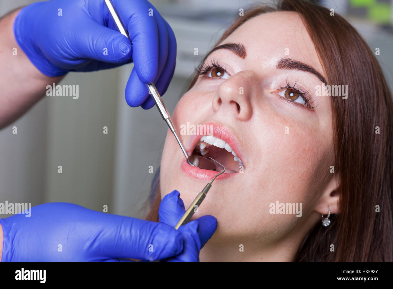 Patient with open mouth and mirror inside at the dentist Stock Photo ...