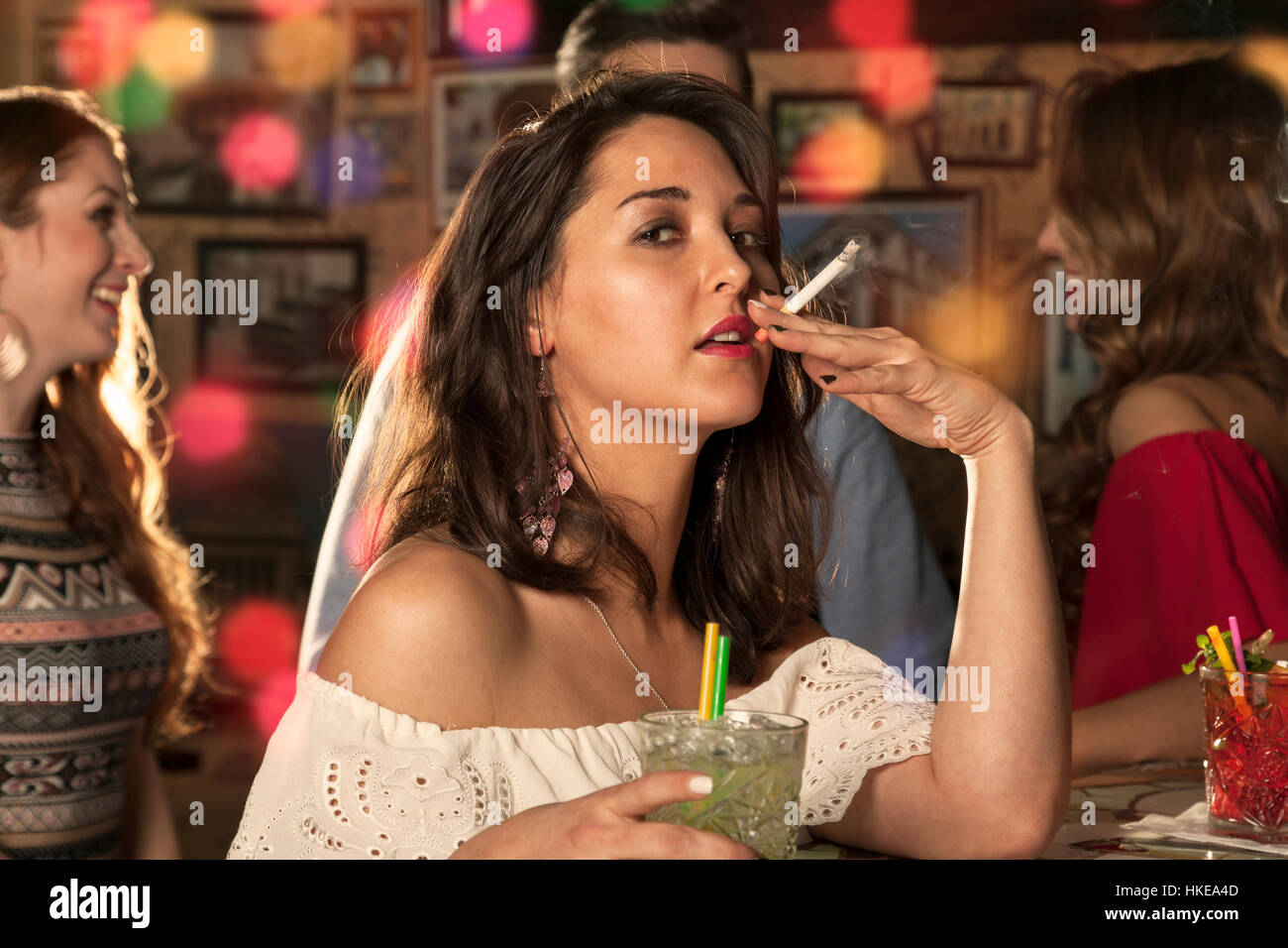 pull on a cigarette Taking a pull of a cigarette hi-res stock photography and images