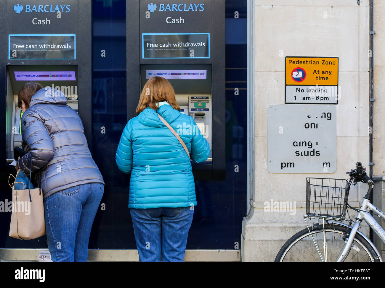 Cornmarket Street, Oxford, United Kingdom, January 22, 2017: Customers using a Barclays Bank ATM Bancomats Free Cash Withdrawals at the branch on Corn Stock Photo