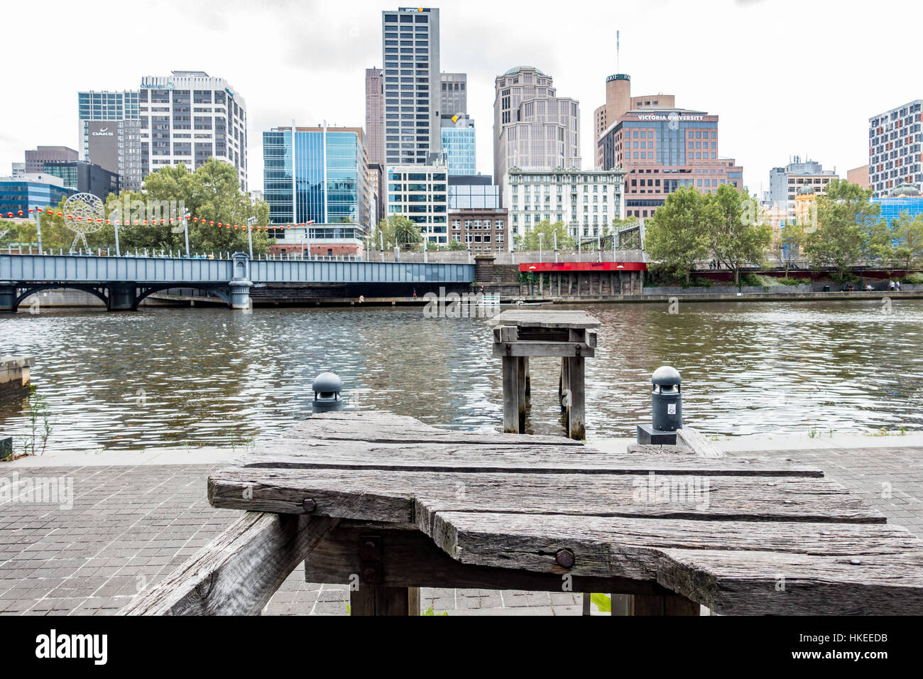 Dilapidated wharf at contrasts with modern Southbank boardwalk, Melbourne, Victoria, Australia. Stock Photo