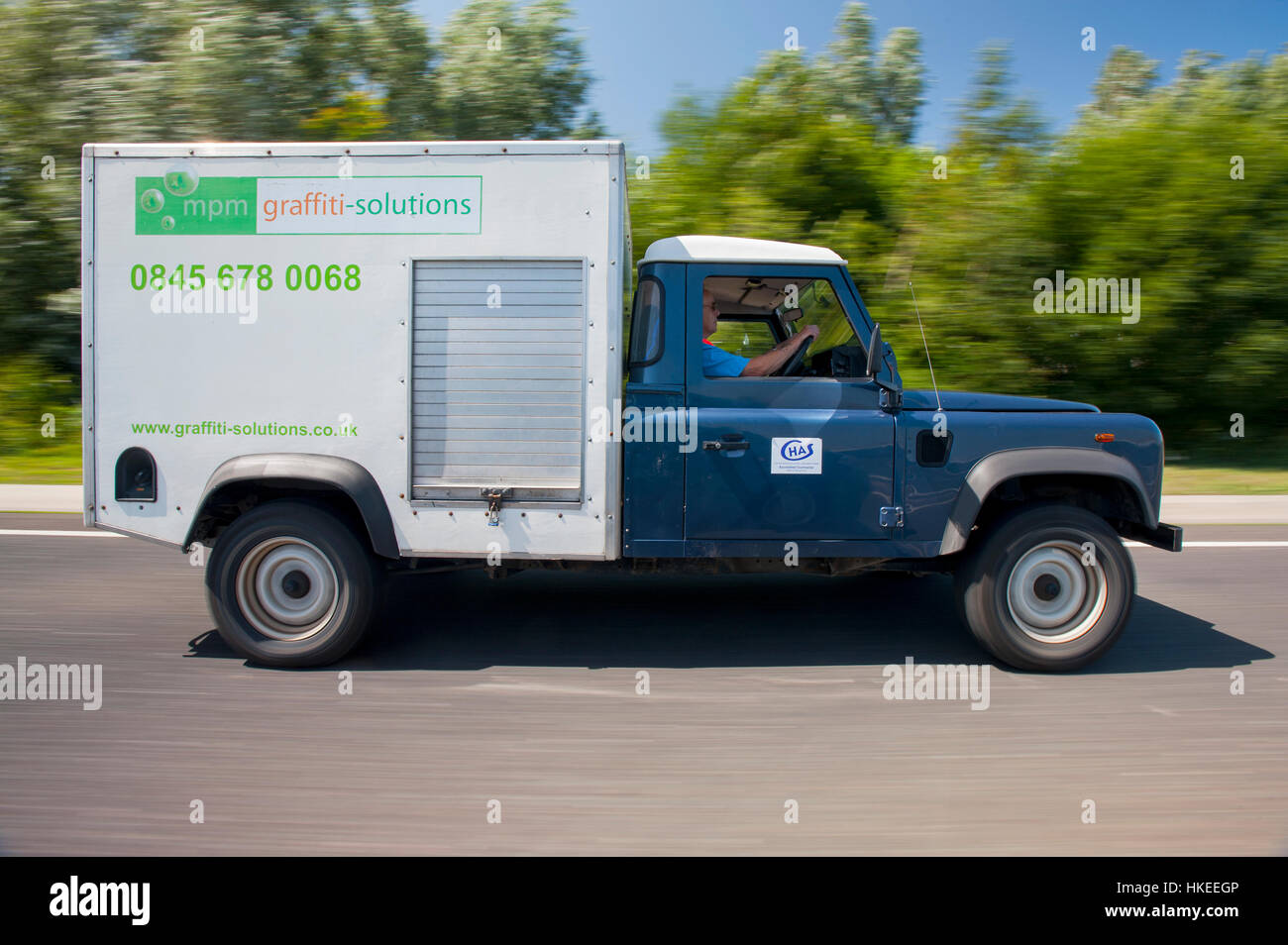 Working Land Rover Defender fitted with a high pressure pump in a box truck back Stock Photo