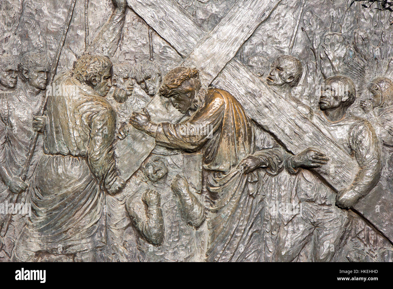 Medjugorje, Bosnia and Herzegovina, 2016/11/11. Bronze relief by Carmelo Puzzolo representing the Way of the Cross. Simon of Cyrene is helping Jesus. Stock Photo