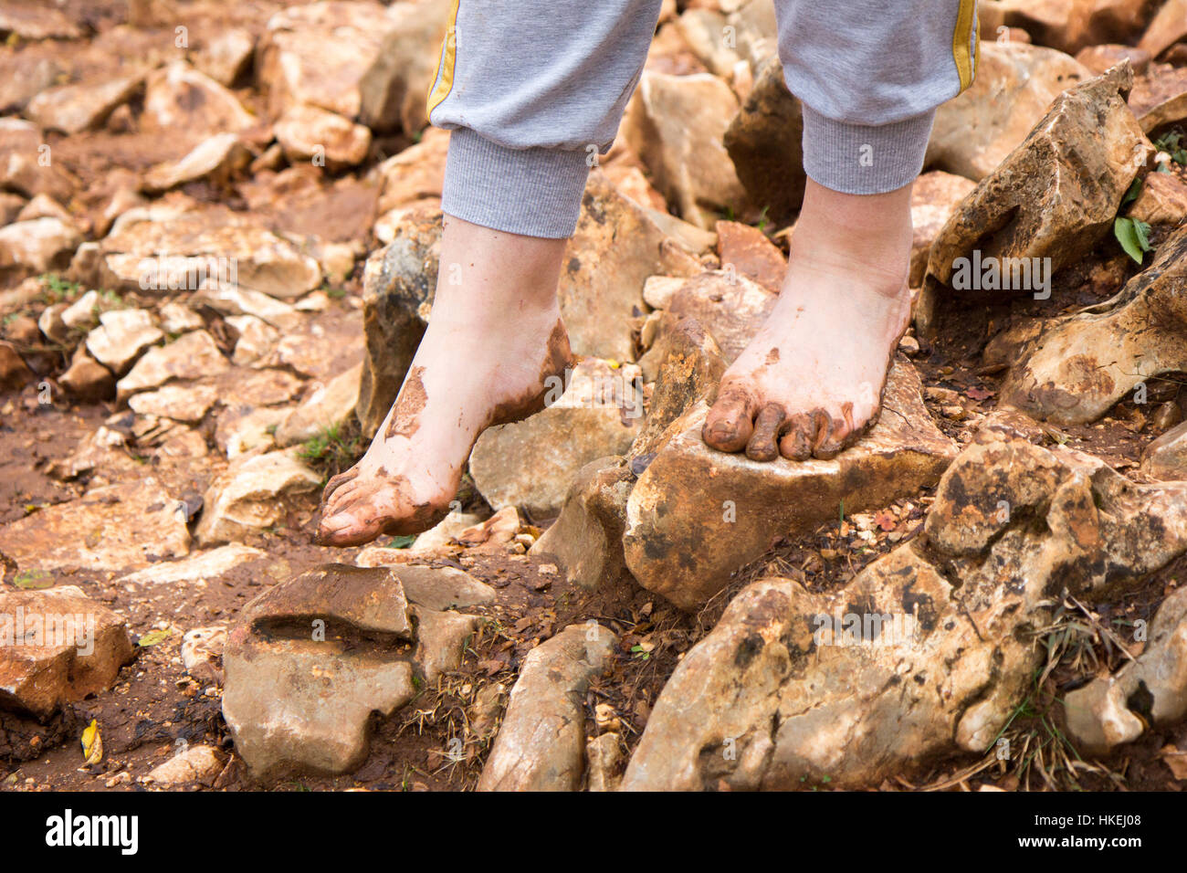 Medjugorje, Bosnia and Herzegovina on 2016/11/12. Female pilgrim walking barefoot to the top of Podbrdo Mountain (Mount of Apparitions). Stock Photo