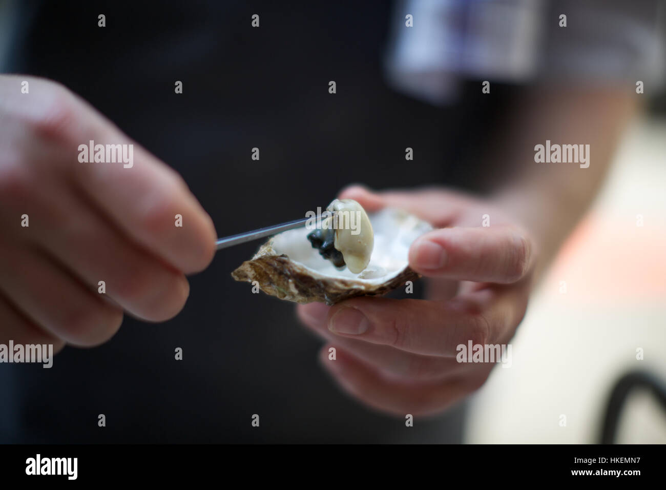 chef opening fresh oyster. food, meat, healthy eating, protein Stock