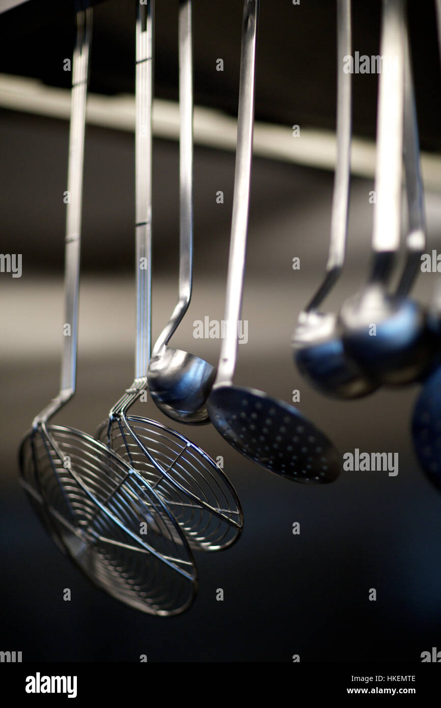 strainers on kitchen rack. kitchen, clean, steel, colander Stock Photo