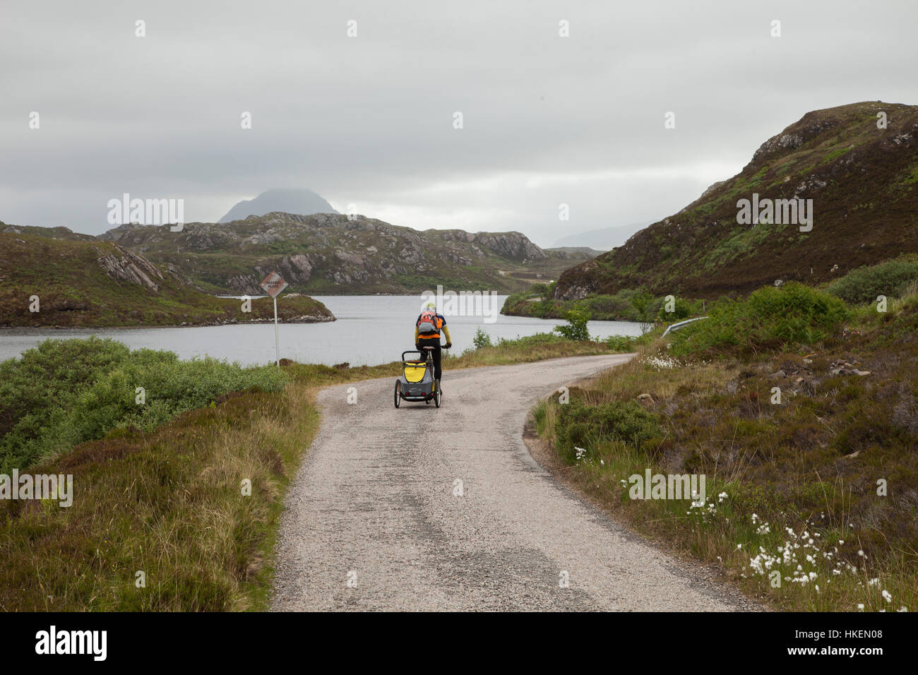 Cycling with croozer Road near Durness Stock Photo