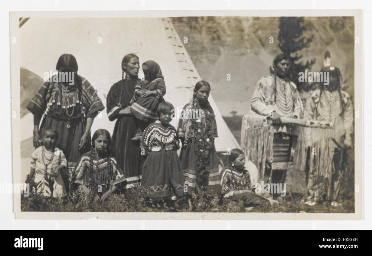 This untitled artwork, displayed at the Brooklyn Museum, portrays a family group consisting of two men, two women, and five girls. The painting highlights familial relationships and depicts a moment of togetherness and unity, showcasing the artist's use of space and character representation. Stock Photo