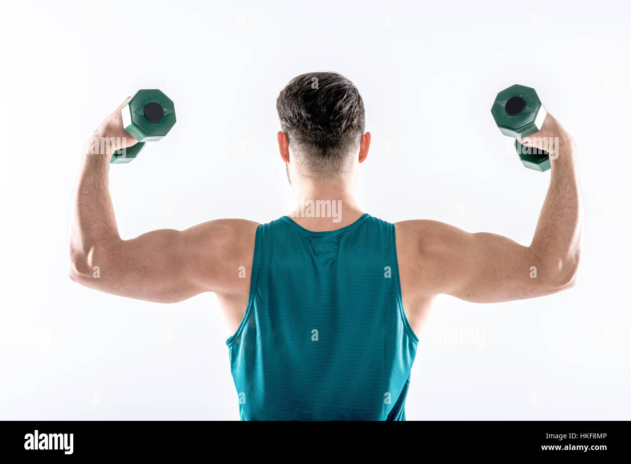 Man exercising with dumbbells Stock Photo